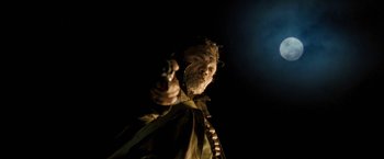 Movie still from “Red Hill” (2010), directed by Patrick Hughes – A man holding a cell phone up to his ear; Close Up shot, Low angle