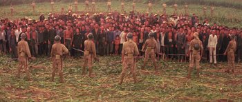 Movie still from “Red Sorghum” (1988), directed by Yimou Zhang – A group of men standing in front of a large crowd; Extreme Wide shot, High angle