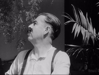 Movie still from “Redes” (1936), directed by Fred Zinnemann – An old photo of a man with a mustache; Close Up shot, Low angle