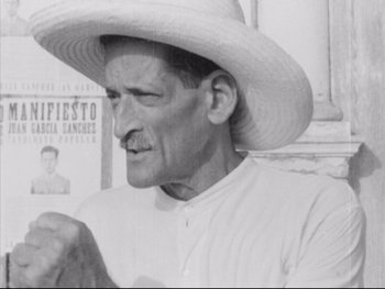 Movie still from “Redes” (1936), directed by Fred Zinnemann – An older man wearing a white shirt and a white hat; Close Up shot, Low angle