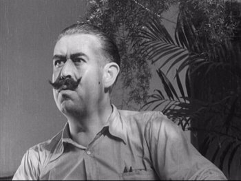 Movie still from “Redes” (1936), directed by Fred Zinnemann – An old photo of a man with a mustache; Close Up shot, Low angle