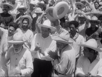 Movie still from “Redes” (1936), directed by Fred Zinnemann – A group of men in white shirts and white hats; Medium shot, High angle