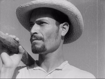 Movie still from “Redes” (1936), directed by Fred Zinnemann – A black and white photo of a man with a hat on; Close Up shot, Low angle