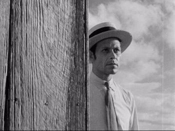 Movie still from “Redes” (1936), directed by Fred Zinnemann – A black and white photo of a man wearing a hat and a tie; Close Up shot, Low angle