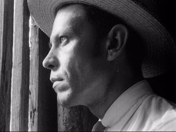 Movie still from “Redes” (1936), directed by Fred Zinnemann – A black and white photo of a man wearing a straw hat; Close Up shot, Low angle