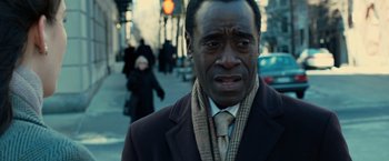 Movie still from “Reign Over Me” (2007), directed by Mike Binder – A man in a suit and tie on the street; Close Up shot, Over the shoulder angle