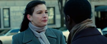 Movie still from “Reign Over Me” (2007), directed by Mike Binder – A woman wearing a jacket and scarf talking to a man; Close Up shot, Over the shoulder angle