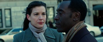 Movie still from “Reign Over Me” (2007), directed by Mike Binder – A woman and a man are standing next to each other; Close Up shot, Over the shoulder angle