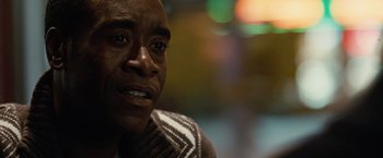 Movie still from “Reign Over Me” (2007), directed by Mike Binder – A man's face with a blurry background; Close Up shot, Over the shoulder angle