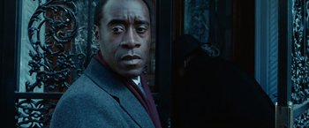 Movie still from “Reign Over Me” (2007), directed by Mike Binder – A person wearing a suit and tie; Close Up shot, Over the shoulder angle