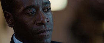 Movie still from “Reign Over Me” (2007), directed by Mike Binder – A man's face in a dark room; Close Up shot, Over the shoulder angle