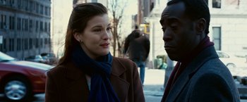 Movie still from “Reign Over Me” (2007), directed by Mike Binder – A woman and a man are standing on the sidewalk; Close Up shot, Over the shoulder angle