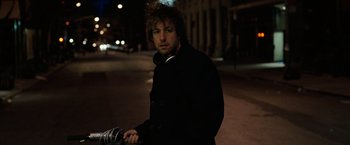 Movie still from “Reign Over Me” (2007), directed by Mike Binder – A man standing on the side of a road at night; Close Up shot, Low angle