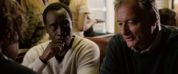 Movie still from “Reign Over Me” (2007), directed by Mike Binder – Two men sitting at a table in front of a window; Close Up shot, Over the shoulder angle