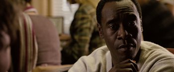 Movie still from “Reign Over Me” (2007), directed by Mike Binder – A person sitting at a table; Close Up shot, Over the shoulder angle