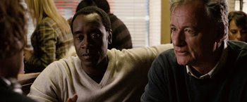 Movie still from “Reign Over Me” (2007), directed by Mike Binder – Two men sitting on a couch in front of a window; Close Up shot, Over the shoulder angle