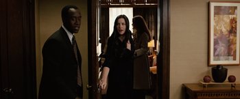 Movie still from “Reign Over Me” (2007), directed by Mike Binder – A woman standing in a doorway next to two men; Medium shot, Over the shoulder angle