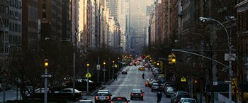 Movie still from “Reign Over Me” (2007), directed by Mike Binder – A city street filled with lots of traffic; Extreme Wide shot, High angle