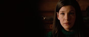 Movie still from “Reign Over Me” (2007), directed by Mike Binder – A woman's face in front of a dark background; Close Up shot, Over the shoulder angle