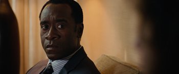 Movie still from “Reign Over Me” (2007), directed by Mike Binder – A person wearing a suit and tie; Close Up shot, Over the shoulder angle