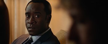 Movie still from “Reign Over Me” (2007), directed by Mike Binder – A person wearing a suit and tie; Close Up shot, Over the shoulder angle