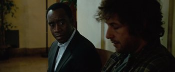 Movie still from “Reign Over Me” (2007), directed by Mike Binder – Two men in suits are looking at each other; Close Up shot, Over the shoulder angle