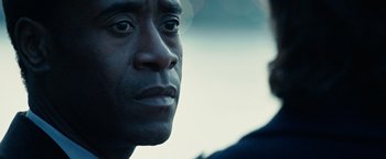 Movie still from “Reign Over Me” (2007), directed by Mike Binder – A man's face with a blurry background; Extreme Close Up shot, Over the shoulder angle
