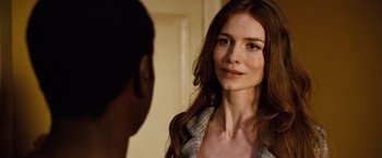 Movie still from “Reign Over Me” (2007), directed by Mike Binder – A woman standing in front of a mirror looking at a man; Close Up shot, Over the shoulder angle