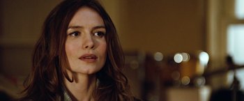Movie still from “Reign Over Me” (2007), directed by Mike Binder – A person with long brown hair; Close Up shot, Over the shoulder angle