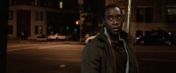 Movie still from “Reign Over Me” (2007), directed by Mike Binder – A man standing on the side of the road at night; Close Up shot, Over the shoulder angle