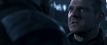 Movie still from “Reign of Fire” (2002), directed by Rob Bowman – A man's face in a car seat; Close Up shot, Over the shoulder angle