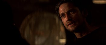 Movie still from “Reign of Fire” (2002), directed by Rob Bowman – A person looking at the camera; Close Up shot, Over the shoulder angle