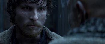 Movie still from “Reign of Fire” (2002), directed by Rob Bowman – A person with a beard; Close Up shot, Over the shoulder angle