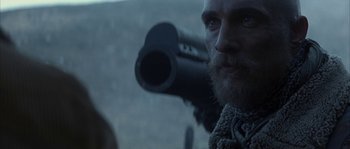 Movie still from “Reign of Fire” (2002), directed by Rob Bowman – A person with a beard; Close Up shot, Low angle