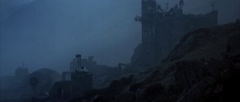 Movie still from “Reign of Fire” (2002), directed by Rob Bowman – A dark picture of a city in the dark; Extreme Wide shot, Low angle