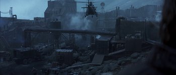 Movie still from “Reign of Fire” (2002), directed by Rob Bowman – An image of a helicopter flying in the air; Extreme Wide shot, High angle