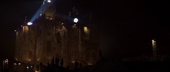 Movie still from “Reign of Fire” (2002), directed by Rob Bowman – A group of people standing on top of a cliff; Extreme Wide shot, Low angle