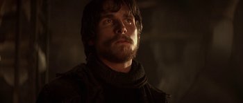 Movie still from “Reign of Fire” (2002), directed by Rob Bowman – A person with a beard; Close Up shot, Low angle