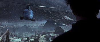 Movie still from “Reign of Fire” (2002), directed by Rob Bowman – A helicopter is flying over an abandoned area; Extreme Wide shot, High angle