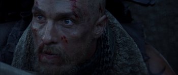 Movie still from “Reign of Fire” (2002), directed by Rob Bowman – A man's face with blood all over his face; Close Up shot, Low angle
