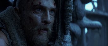 Movie still from “Reign of Fire” (2002), directed by Rob Bowman – A person with a beard; Close Up shot, Low angle