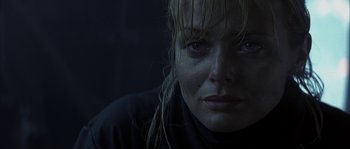 Movie still from “Reign of Fire” (2002), directed by Rob Bowman – A person with wet hair; Close Up shot, Low angle