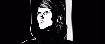 Movie still from “Renaissance” (2006), directed by Christian Volckman – A black and white image of a woman in a black jacket; Close Up shot, Low angle