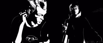 Movie still from “Renaissance” (2006), directed by Christian Volckman – A black and white image of a man and a woman; Close Up shot, Low angle