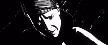 Movie still from “Renaissance” (2006), directed by Christian Volckman – A black and white image of a man's face; Extreme Close Up shot, Low angle