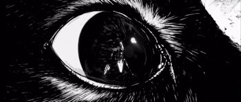 Movie still from “Renaissance” (2006), directed by Christian Volckman – An image of an eye that is reflected in the glass; Extreme Close Up shot, Overhead angle