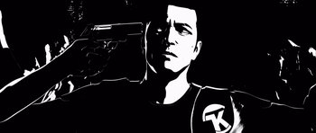 Movie still from “Renaissance” (2006), directed by Christian Volckman – A black and white image of a man holding a gun; Close Up shot, Overhead angle