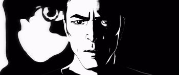 Movie still from “Renaissance” (2006), directed by Christian Volckman – A black and white image of a man's face; Close Up shot, Low angle