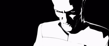 Movie still from “Renaissance” (2006), directed by Christian Volckman – A black and white image of a man's face; Extreme Close Up shot, Low angle