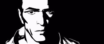 Movie still from “Renaissance” (2006), directed by Christian Volckman – A black and white image of a man's face; Extreme Close Up shot, Low angle